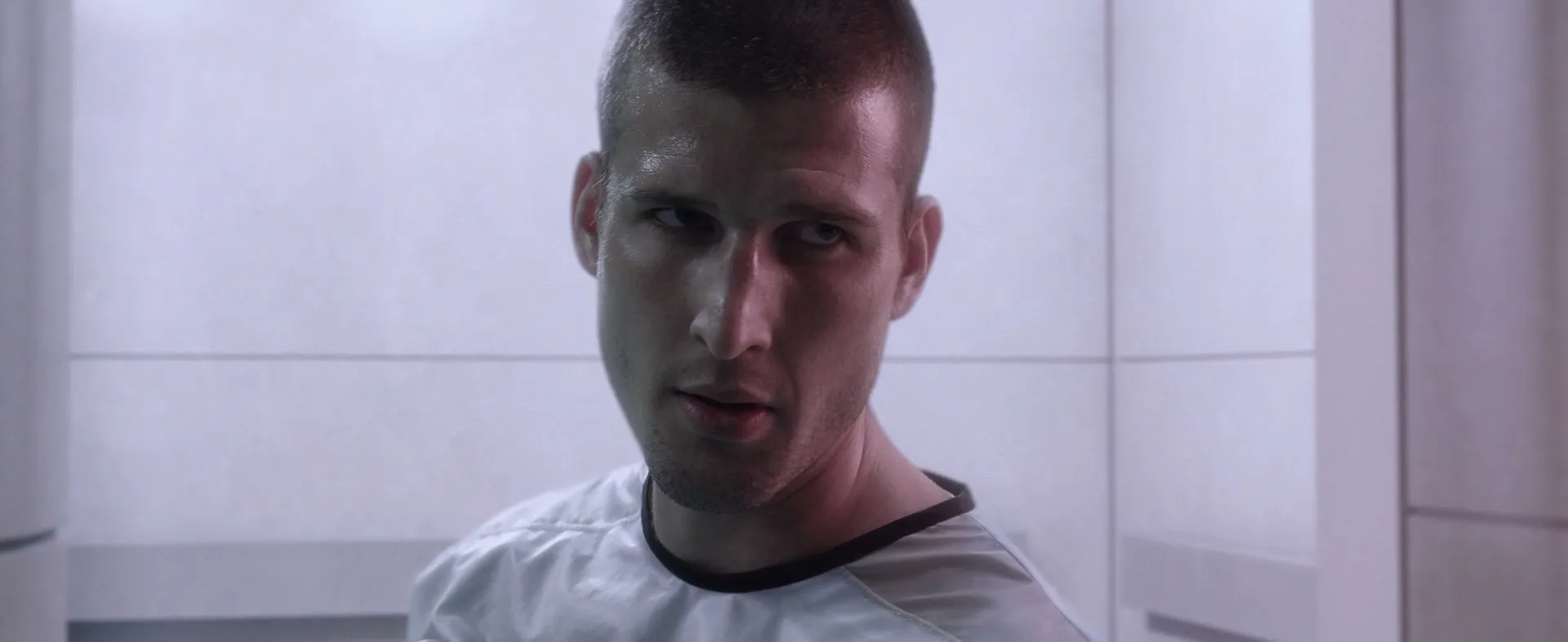 The young telepath, close up, in a white clinical room, from Polis