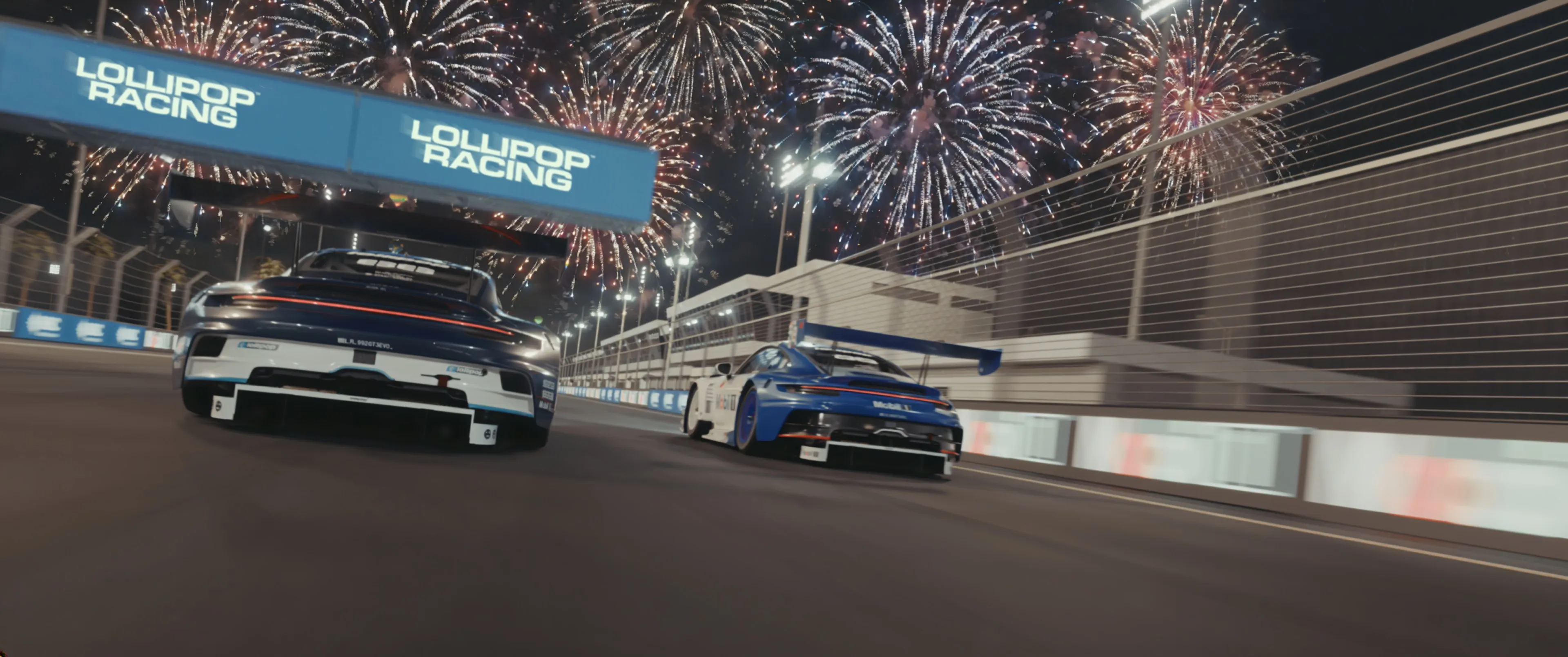 Two Porsches side by side on a night street circuit under fireworks and Lollipop Racing banners, from Lollipop Racing: Episode Zero