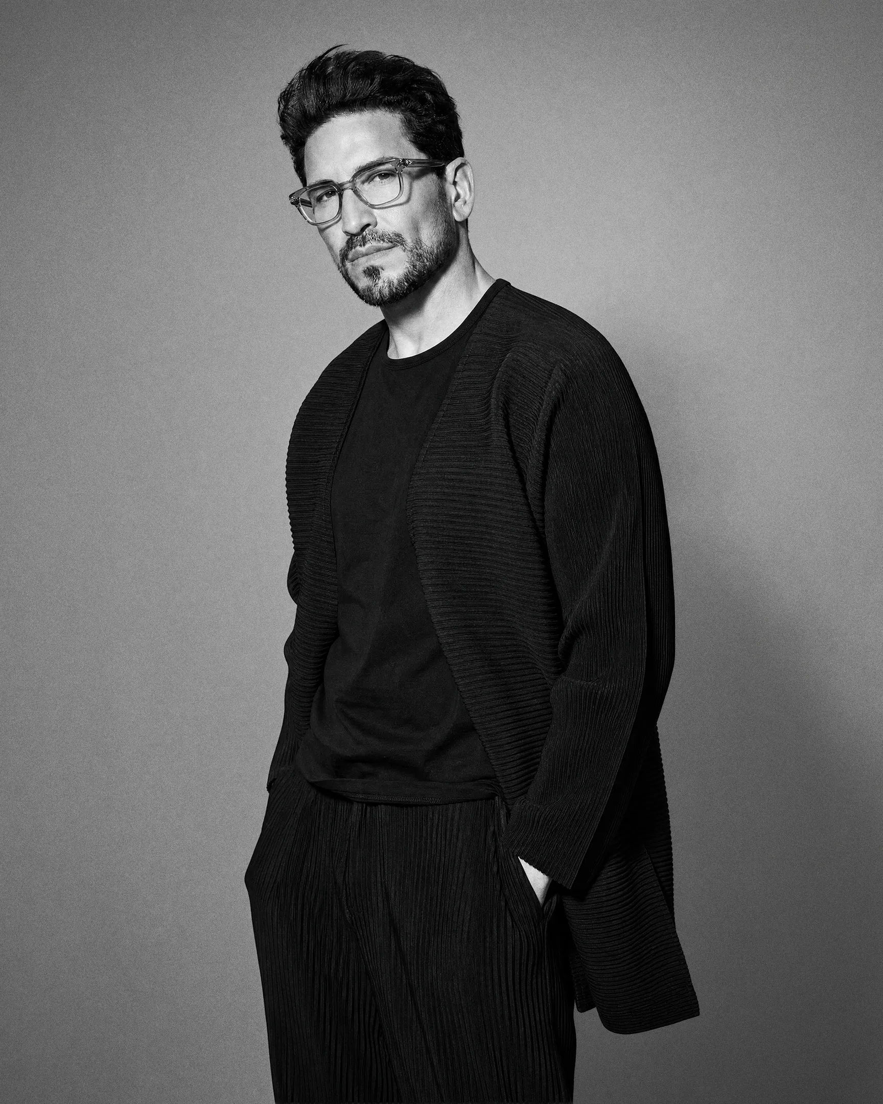 Steven Ilous, standing, black-and-white editorial portrait